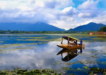 Srinagar, Jammu & Kashmir, India – June 1st., 2014: I made this shot at the beautiful Nagin Lake in Kashmir.This shikara was actually a shop on the move.